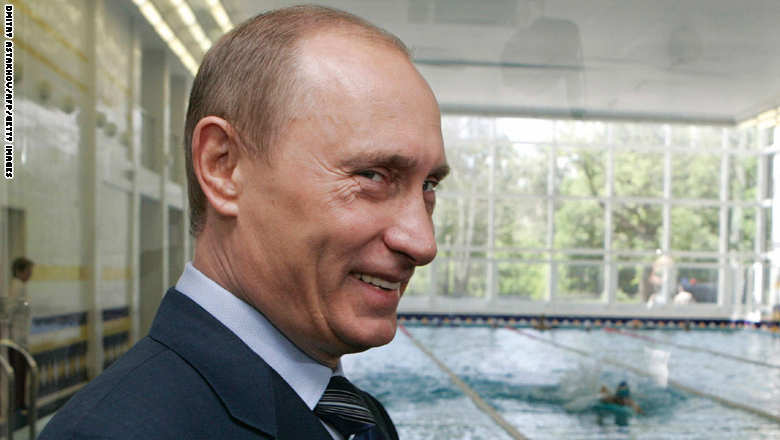 Russian President Vladimir Putin smiles