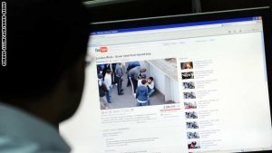 A man watches a video clip on youtube of