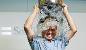 SoftBank Corp. Chief Executive Masayoshi Son dumps a bucket of ice water onto himself as he takes part in the ALS ice bucket challenge at the company headquarters in Tokyo August 20, 2014. The Ice Bucket Challenge is aimed at raising awareness of � and money to fight � Amyotrophic Lateral Sclerosis, more often known as ALS or Lou Gherig's Disease. It involves participants dousing themselves with buckets of ice water, and then nominating others to do so. Nominees may also choose to donate to the cause as a way out of doing the challenge, or in addition to doing it. REUTERS/Toru Hanai (JAPAN - Tags: BUSINESS HEALTH SOCIETY TELECOMS)