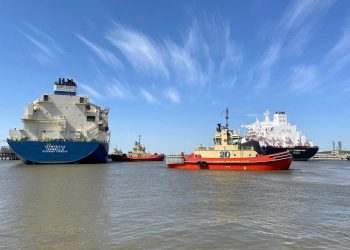FILE PHOTO: An LNG tanker is guided by tug boats at the Cheniere Sabine Pass LNG export unit in Cameron Parish, Louisiana