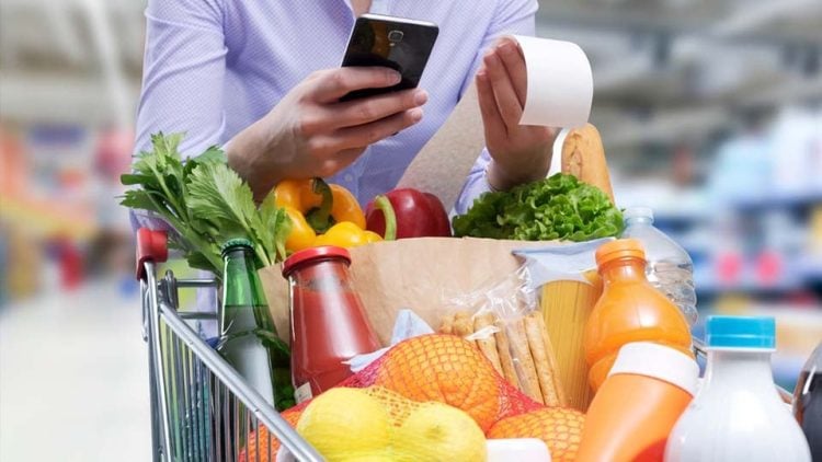 tcard woman checking groceries receipt 868