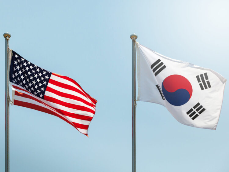 waving the American flag, the Star-Spangled Banner, the Stars and Stripes and south korean flag on blue sky, korean and us alliance, us and korean alliance